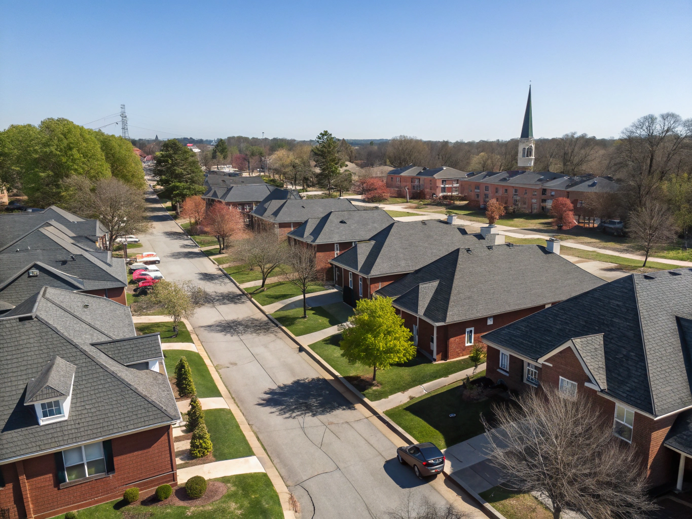 Aerial view of a wooded residential neighborhood, illustrative image